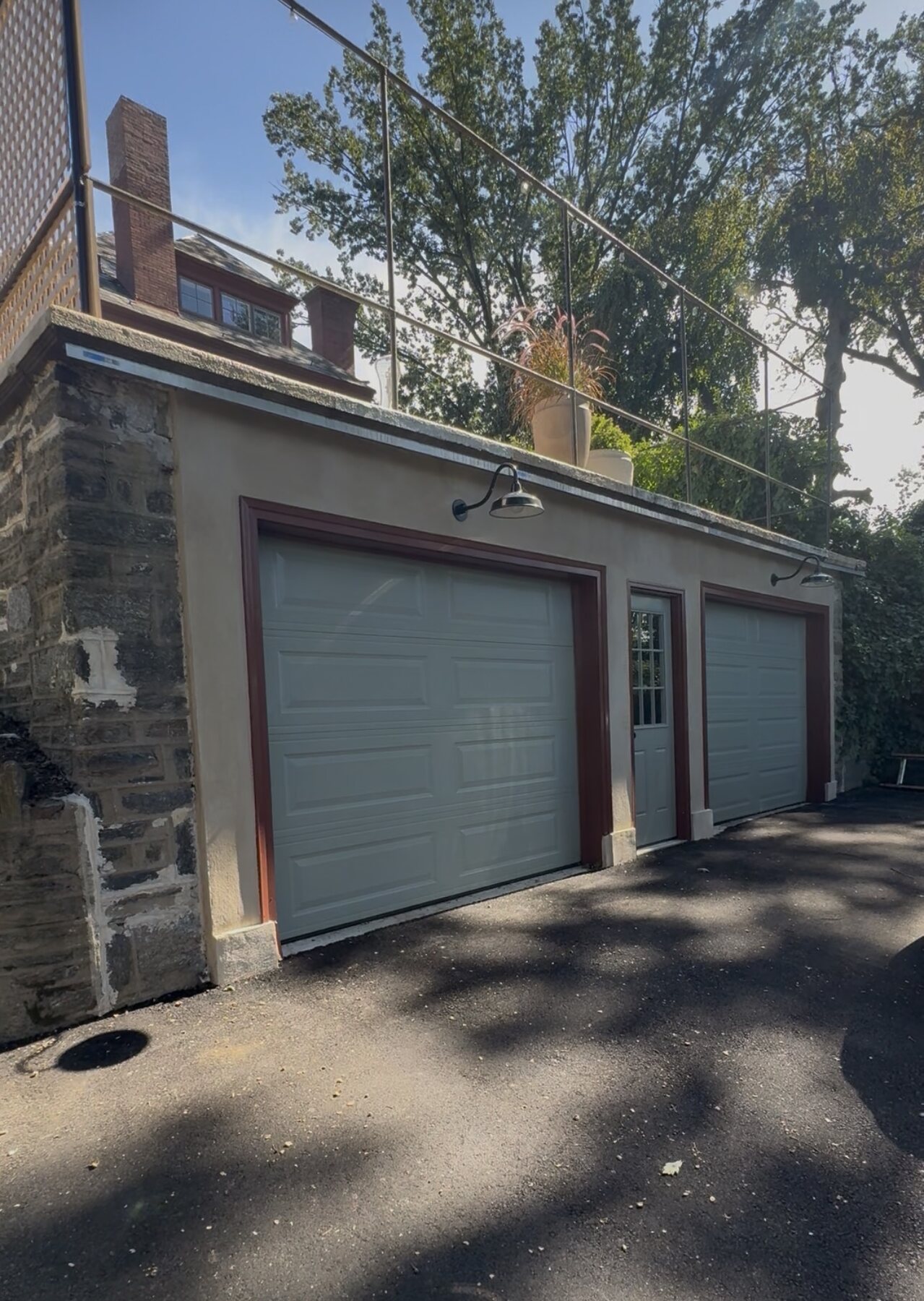 Garage after reconstruction with new doors and finished exterior