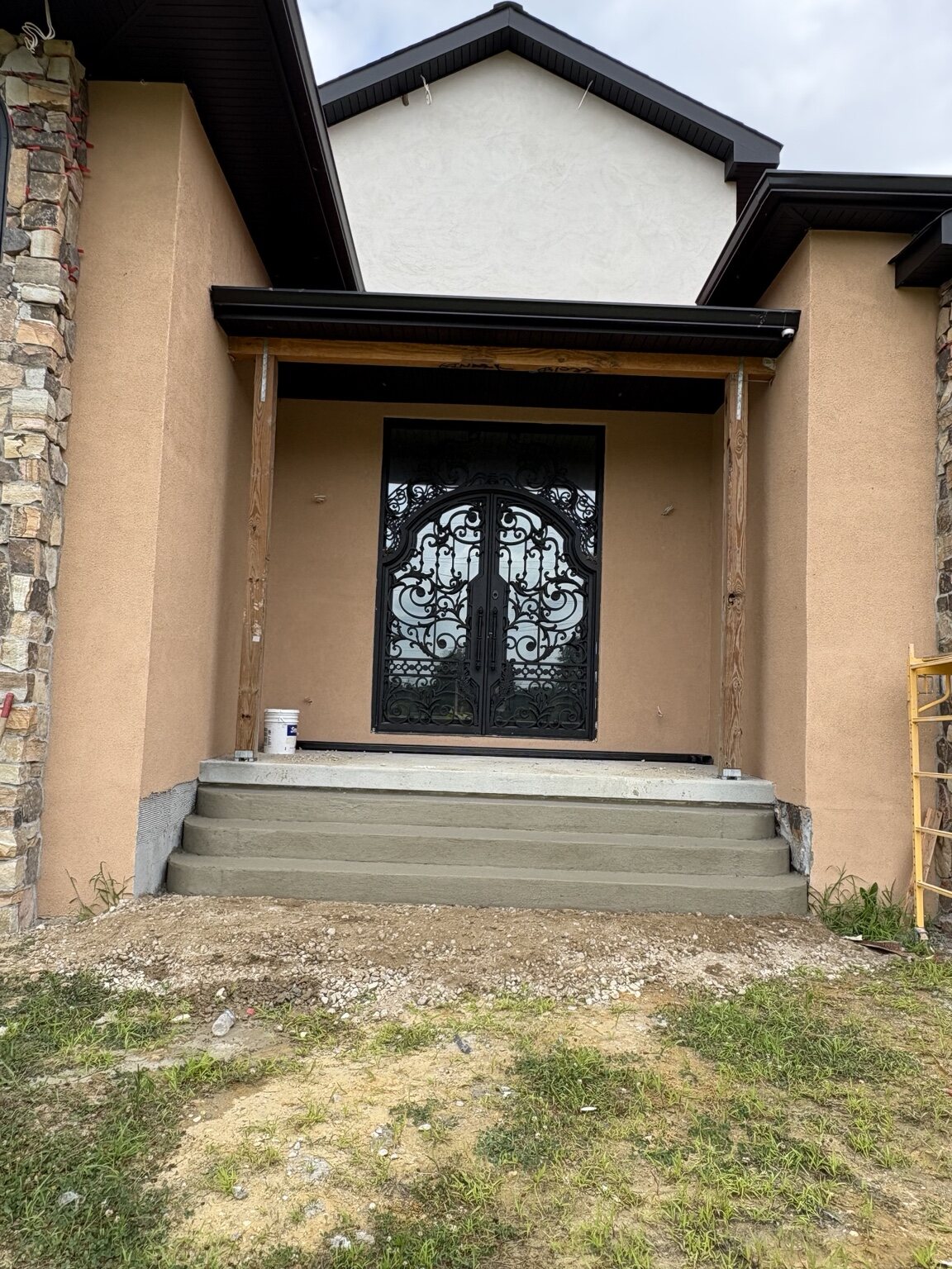 Front entrance after new concrete steps were built