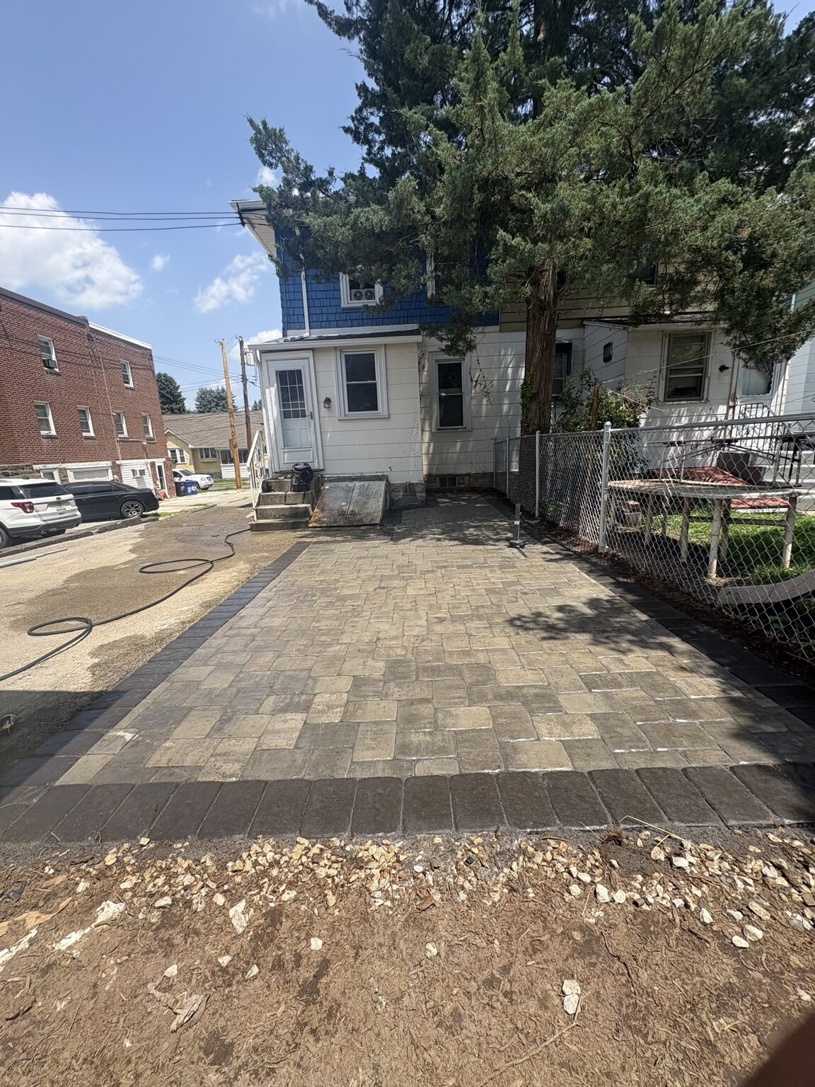 Completed paver driveway with contrasting border